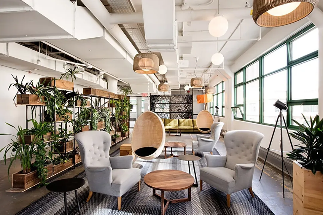 Biophilic design examples highlighting Etsy's communal spaces and green office elements.