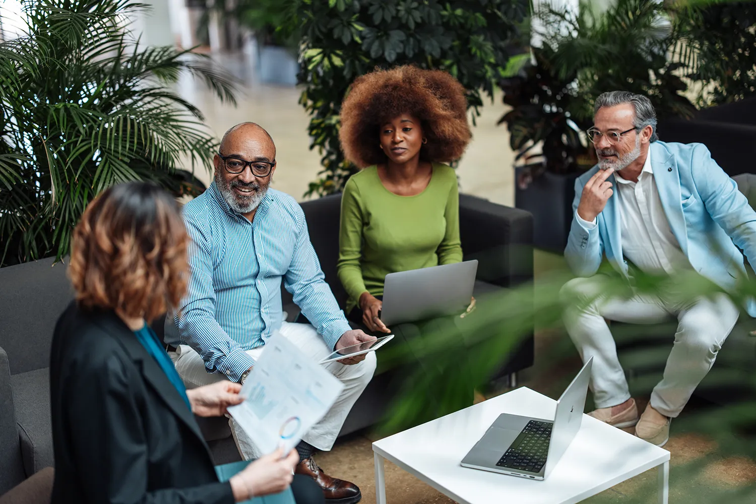 Employees experiencing improved mental health through biophilic design and office plants.